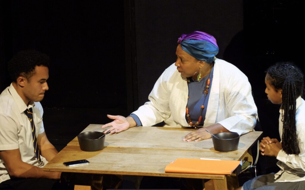 A conversation between WITNESS characters across a table